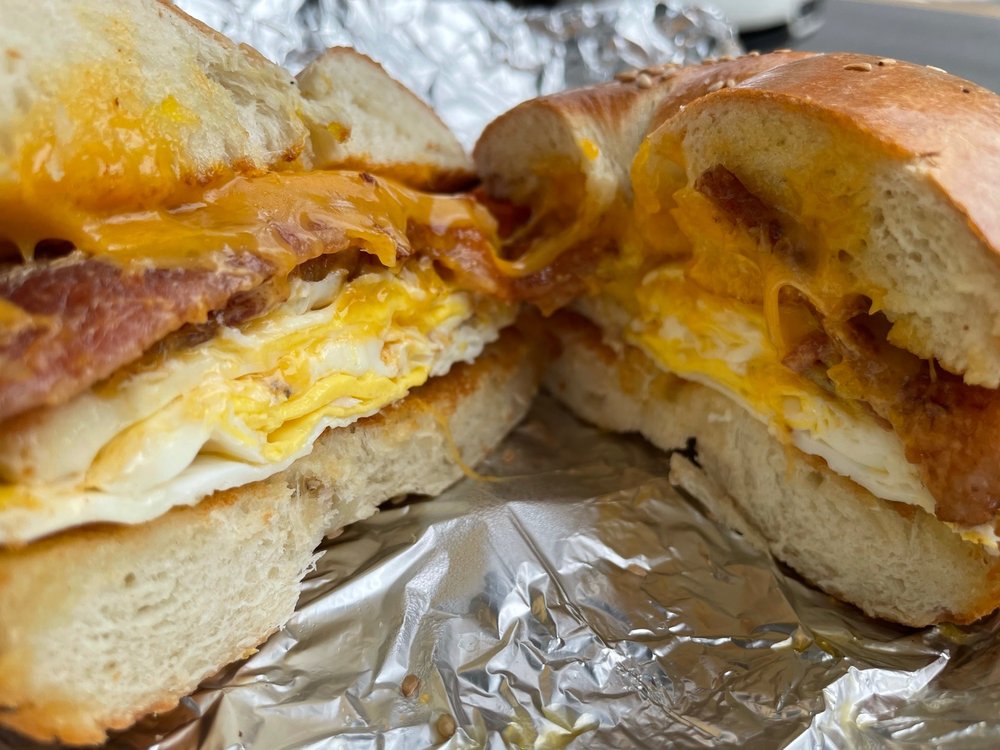 Breakfast sandwich with egg, choice of meat, and cheese on bagel, toast or bun